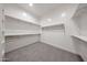 A bright and modern walk-in closet featuring shelving at 1101 E Dolores Rd, Phoenix, AZ 85086
