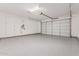 Attached garage with epoxy flooring and storage at 11530 S 50Th Ln, Laveen, AZ 85339