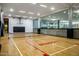 Hardwood basketball court with hoops and net at 7127 E Rancho Vista Dr # 4012, Scottsdale, AZ 85251