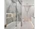 Elegant bathroom with a modern tub, marble walls, and glass shower doors at 7127 E Rancho Vista Dr # 4012, Scottsdale, AZ 85251