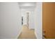 Hallway with wood floors and white walls and a glimpse of a living space at 7127 E Rancho Vista Dr # 4012, Scottsdale, AZ 85251