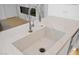 Gourmet kitchen island features a large sink, modern faucet, and marble countertop at 7127 E Rancho Vista Dr # 4012, Scottsdale, AZ 85251