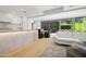Open living space with white couch, island, and sliding glass doors to a patio at 7127 E Rancho Vista Dr # 4012, Scottsdale, AZ 85251