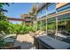 Private patio with dining table, lounge chairs, and lush landscaping, perfect for outdoor entertaining at 7127 E Rancho Vista Dr # 4012, Scottsdale, AZ 85251