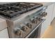Professional-grade stainless steel range with multiple burners and oven at 7127 E Rancho Vista Dr # 4012, Scottsdale, AZ 85251