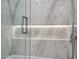 Stylish shower showcasing marble walls, a glass door, and modern fixtures at 7127 E Rancho Vista Dr # 4012, Scottsdale, AZ 85251