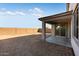 Large backyard featuring a blank slate ready for landscaping and outdoor activities at 17632 W Oregon Ave, Litchfield Park, AZ 85340