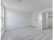 Clean bedroom space with neutral carpet, fresh paint, and walk in closet at 17632 W Oregon Ave, Litchfield Park, AZ 85340