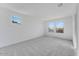 Spacious bedroom featuring neutral carpet, natural light from multiple windows, and fresh paint at 17632 W Oregon Ave, Litchfield Park, AZ 85340