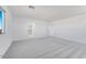 Bedroom featuring neutral carpet, bright natural light, and ensuite bathroom at 17632 W Oregon Ave, Litchfield Park, AZ 85340