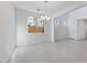 Dining room with chandelier lighting and large window at 17632 W Oregon Ave, Litchfield Park, AZ 85340