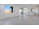 Bright living room featuring tile floors and sliding glass doors to outdoor space at 17632 W Oregon Ave, Litchfield Park, AZ 85340