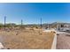 Community playground with modern play structures, picnic shelter, and seating under a clear blue sky at 17632 W Oregon Ave, Litchfield Park, AZ 85340