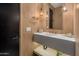 Stylish bathroom with floating vanity and vertical wood tile at 24863 N 103Rd N Way, Scottsdale, AZ 85255