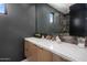 Elegant bathroom with modern vanity and dark-colored walls at 24863 N 103Rd N Way, Scottsdale, AZ 85255