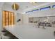 Modern kitchen with wine storage and a large island at 24863 N 103Rd N Way, Scottsdale, AZ 85255