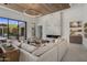 Spacious living room with a marble fireplace and access to a patio at 24863 N 103Rd N Way, Scottsdale, AZ 85255