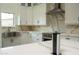 Modern kitchen island with built-in power and USB ports at 7917 E Bonnie Rose Ave, Scottsdale, AZ 85250