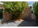 Private patio with flagstone and flowering tree at 7917 E Bonnie Rose Ave, Scottsdale, AZ 85250