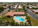 Community pool with lounge chairs and umbrellas at 7917 E Bonnie Rose Ave, Scottsdale, AZ 85250