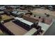 Aerial view of house showcasing the backyard, driveway and surrounding neighborhood at 8702 E Boise St, Mesa, AZ 85207