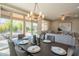 Modern dining room with large table, chandelier, and view of the backyard at 17983 E Vista Desierto --, Rio Verde, AZ 85263