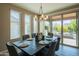 Bright dining room with a table set for six and view of backyard at 17983 E Vista Desierto --, Rio Verde, AZ 85263