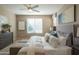 Main bedroom with king bed, neutral decor, and large windows at 17983 E Vista Desierto --, Rio Verde, AZ 85263