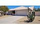 Well-maintained house with a spacious driveway and mature plants at 2605 N 133Rd Ave, Goodyear, AZ 85395