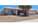 Tan house with a covered patio and gravel landscaping at 2605 N 133Rd Ave, Goodyear, AZ 85395