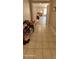 Hallway with tile flooring, leading to bedrooms at 2605 N 133Rd Ave, Goodyear, AZ 85395