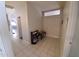 Welcoming hallway with tile floors and bench at 2605 N 133Rd Ave, Goodyear, AZ 85395