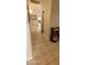 Bright hallway with tile flooring and access to other rooms at 2605 N 133Rd Ave, Goodyear, AZ 85395