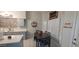 Bright kitchen with island, white countertops, and gray cabinets at 2605 N 133Rd Ave, Goodyear, AZ 85395