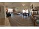 Open living and dining area with wood-look flooring at 2605 N 133Rd Ave, Goodyear, AZ 85395