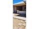 Covered patio with flagstone walkway and desert landscaping at 2605 N 133Rd Ave, Goodyear, AZ 85395