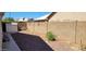 Backyard with block wall, storage shed, and gravel at 2605 N 133Rd Ave, Goodyear, AZ 85395