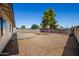 The spacious backyard is enclosed by a privacy fence and features low-maintenance landscaping at 3222 W Wagoner Rd, Phoenix, AZ 85053