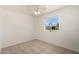 Bedroom featuring tile floors, a ceiling fan, and a window with a backyard view at 3222 W Wagoner Rd, Phoenix, AZ 85053