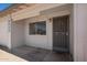 Front door with security screen, adjacent window, and house numbers, providing curb appeal and security at 3222 W Wagoner Rd, Phoenix, AZ 85053