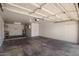 Spacious garage with white walls, water heater and garage door opener at 3222 W Wagoner Rd, Phoenix, AZ 85053