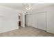 Spacious main bedroom with tile floors, ceiling fan, and closet with mirrored doors at 3222 W Wagoner Rd, Phoenix, AZ 85053
