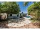 Backyard with a spacious patio, large trees, and a view of the pool and covered outdoor space at 4020 W Anderson Dr, Glendale, AZ 85308