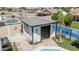Backyard with a private structure and pool access. Landscaping includes palm trees and rock features at 4020 W Anderson Dr, Glendale, AZ 85308