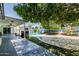 The home features a shaded patio with a built-in bar, a pool, and a mural, perfect for entertaining outdoors at 4020 W Anderson Dr, Glendale, AZ 85308