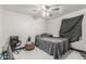 Cozy bedroom features neutral walls, white tile flooring, and an open closet at 4020 W Anderson Dr, Glendale, AZ 85308