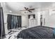 A bedroom featuring a dark floor, natural lighting, and modern decor at 4020 W Anderson Dr, Glendale, AZ 85308