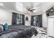 A bedroom featuring dark accents, natural lighting, and modern decor at 4020 W Anderson Dr, Glendale, AZ 85308