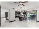 Bright kitchen with black cabinets, stainless steel appliances, island seating, and pool views at 4020 W Anderson Dr, Glendale, AZ 85308