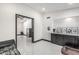 The room showcases an open layout with white tiled floors, dark trim, and modern fixtures at 4020 W Anderson Dr, Glendale, AZ 85308